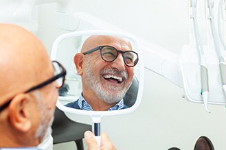  The long-term benefits of dental implants include saving you time and money on replacement costs