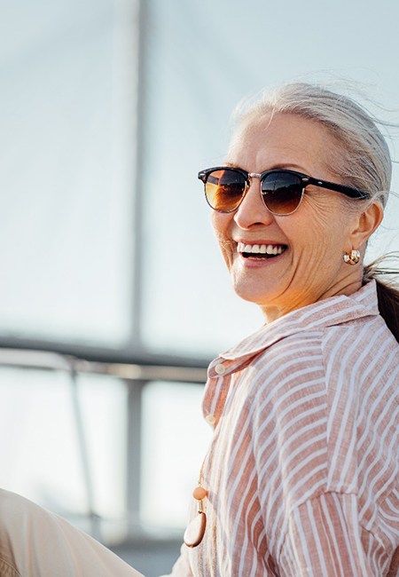 a woman sitting on a boat and smiling