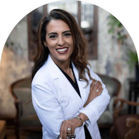 Lutz Florida dentist Doctor Shabnam Tehrani smiling with arms crossed