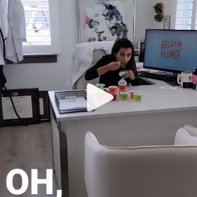 Dental office receptionist eating cup of gelatin