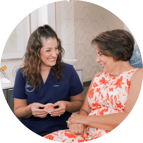 Dental team member talking with a patient