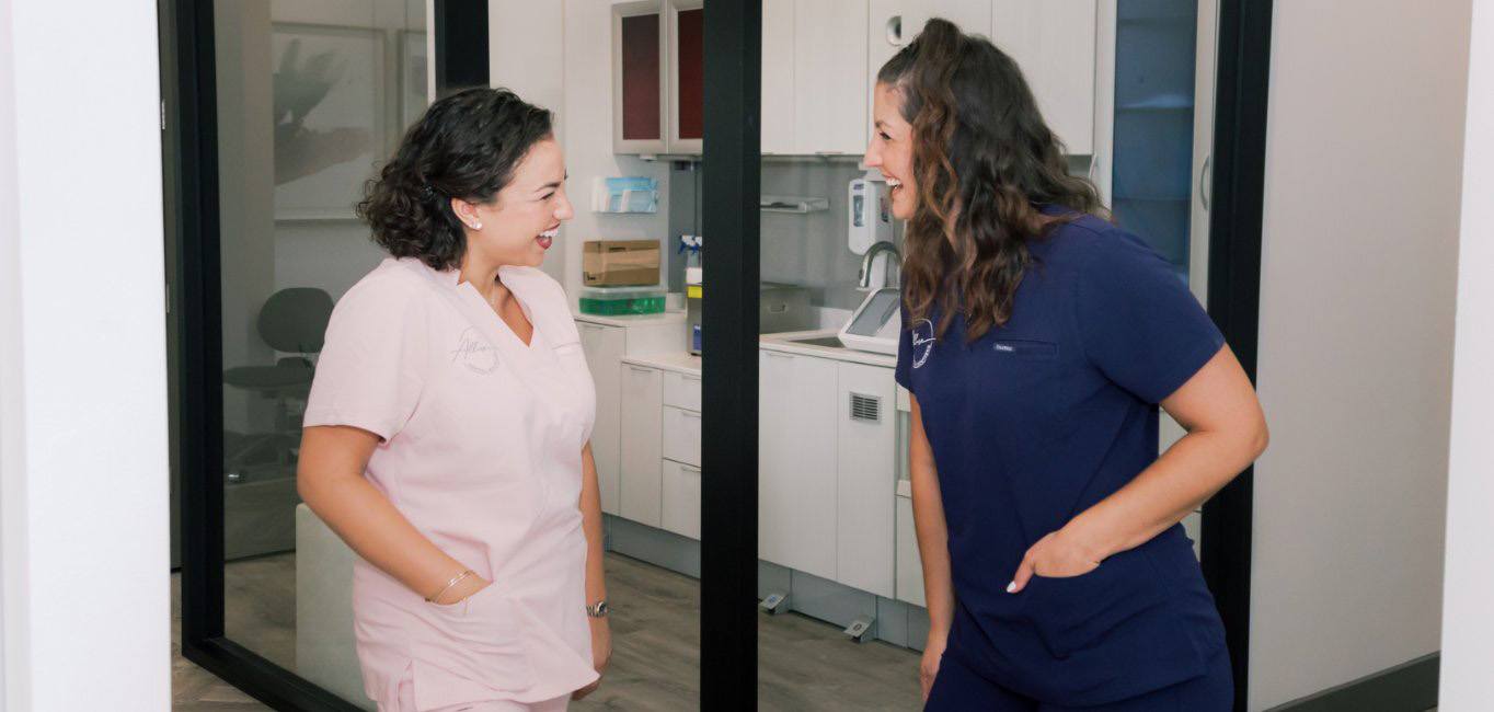 Lutz dental team member laughing with a patient