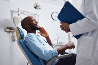Man smiling at the dentist