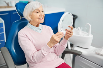 Woman smiling in the dental chair