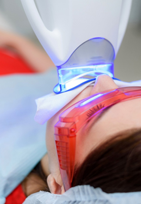 Patient undergoing in-office teeth whitening 