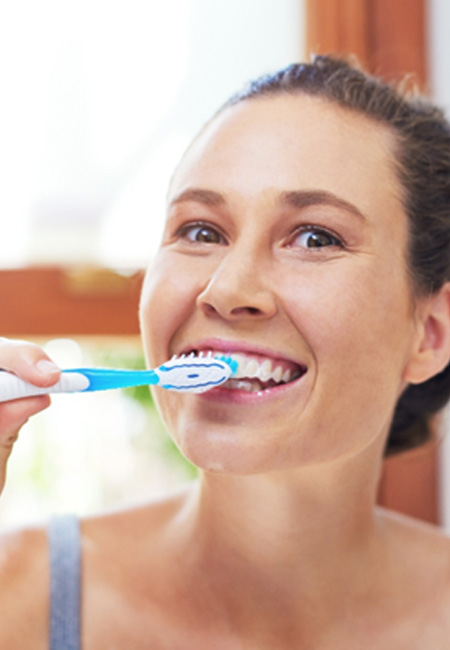 Woman brushing her teeth 