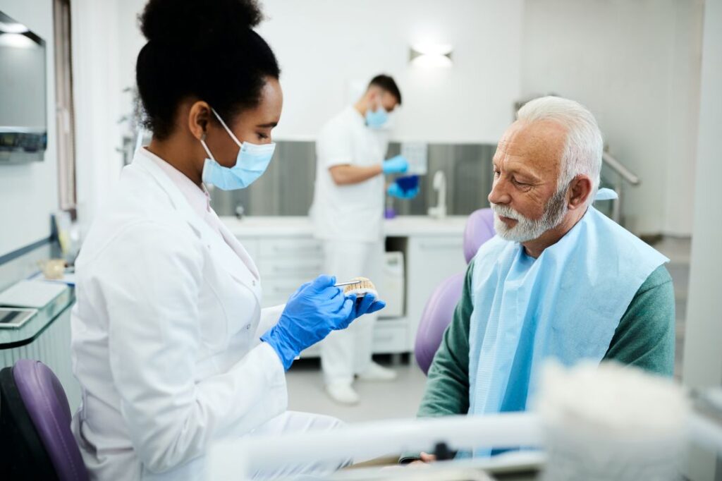 A man at the dentist getting new dentures.