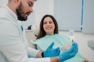 Woman learning how to better care for her dentures