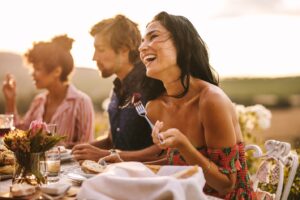 a woman eating with her friends